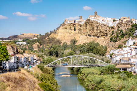 View of Arcos de la Frontera town and municipality in the Sierra de Cadiz comarca, in Andalusia, Spain on Guadalete river on cliffs, white town or Pueblos Blancosの写真素材