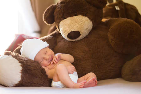 Newborn Napping With Teddyの写真素材
