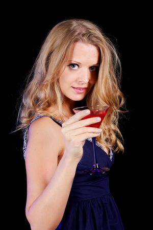 a charming young lady holding a glass of red wineの写真素材