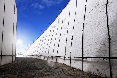 white brick wall against blue skyの写真素材
