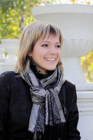 Young beautiful woman in the autumn parkの写真素材