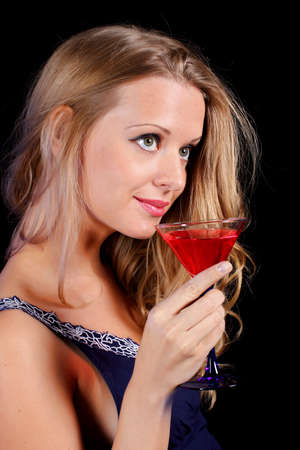 a charming young lady holding a glass of red wineの写真素材