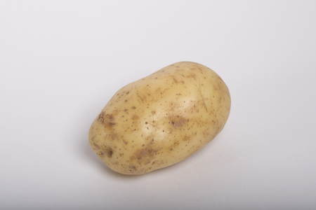 Raw potato isolated on white background.の写真素材