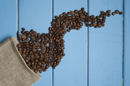Coffee beans on a wooden blue background.の写真素材