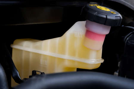 Car service. Close-up of a reservoir for brake fluid in a car engine. Brake fluid tank.の写真素材