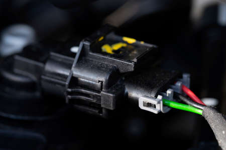 Auto electrician close-up. Car service. Diagnostics of electrical wiring. Car wire connector.の写真素材