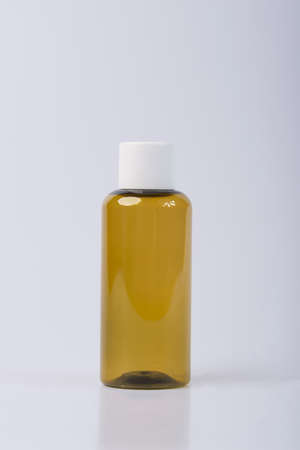 Blank cosmetic packaging mockup. Small jar for essential oils. Bottle for cosmetics on a white background.の写真素材