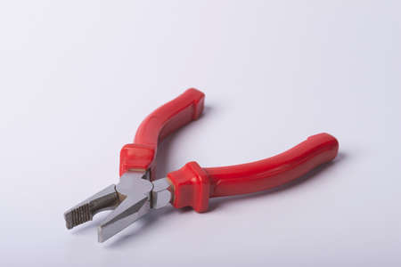 Pliers on a white background. Close-up of pliers on a white background.