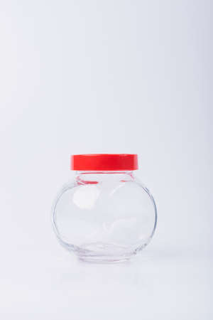 Blank cosmetic packaging mockup. Small jar for essential oils. Bottle for cosmetics on a white background.の写真素材