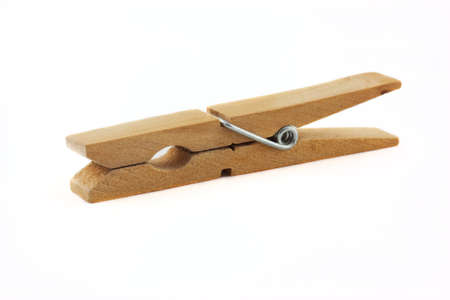 Wooden clothes peg isolated on a white background.の写真素材