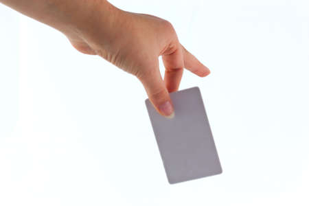 plastic bank card in his hand on a white background.の写真素材