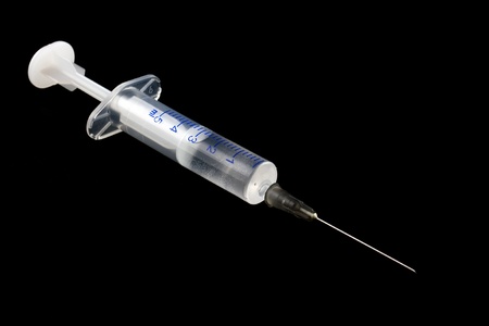 Medical shrits of liquid on a black background.の写真素材