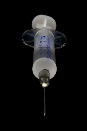 Medical shrits of liquid on a black background.の写真素材