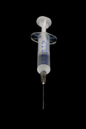Medical shrits of liquid on a black background.の写真素材