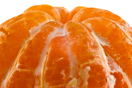One juicy tangerine peeled on a white background.の写真素材