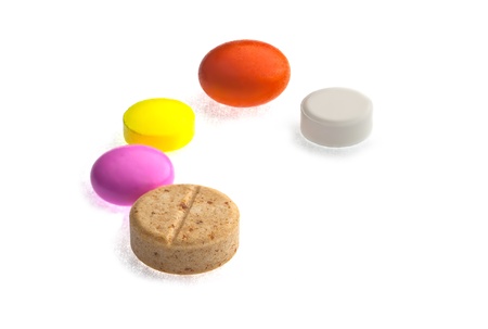  A lot of tablets in a dish isolated on a white background.の写真素材