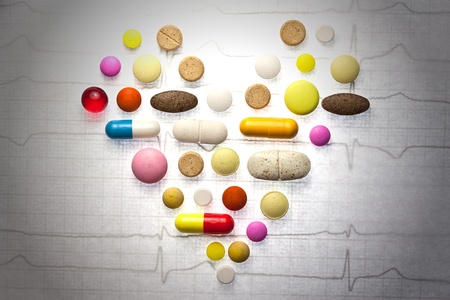 Different pills posted on ECG in the form of the heart の写真素材