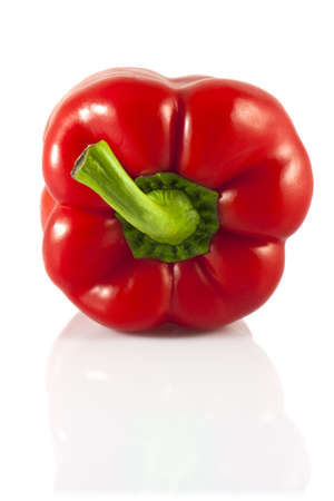A juicy, raw red peppers on a white background の写真素材