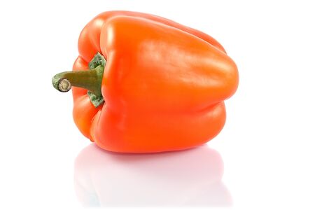 A juicy, raw orange peppers on a white background の写真素材