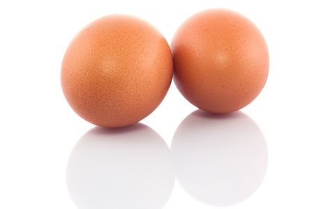 Two chicken eggs isolated on white background の写真素材
