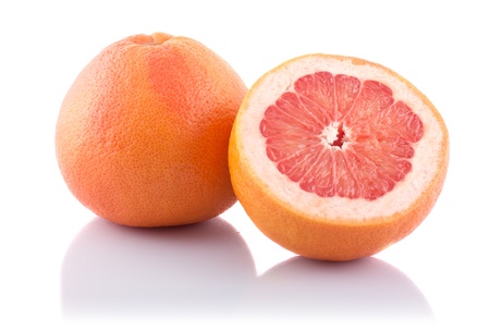 Half of fresh grapefruit on white background の写真素材