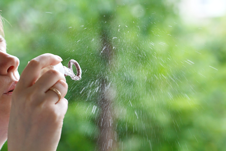 Soap ball in daylight against a background of greenery.の写真素材