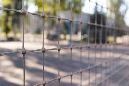 Rusty old armored fence. The small depth of field.の写真素材