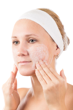 A young girl makes a face mask.の写真素材