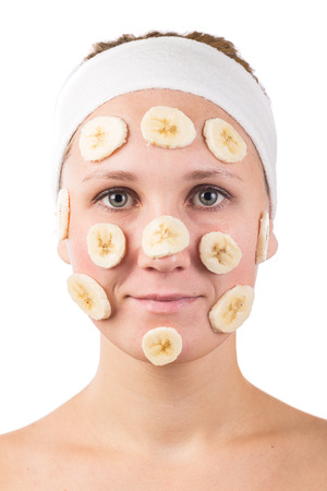 A young girl makes a face mask.の写真素材