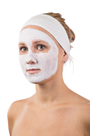 A young girl makes a face mask.の写真素材