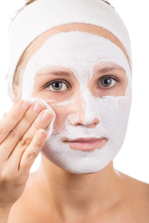 A young girl makes a face mask.の写真素材