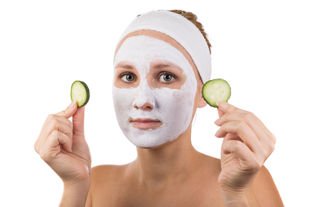A young girl makes a face mask.の写真素材