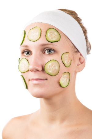 A young girl makes a face mask.の写真素材