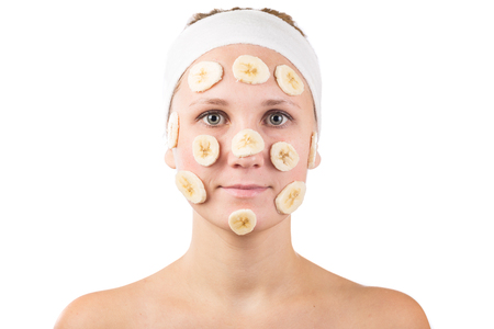 A young girl makes a face mask.の写真素材