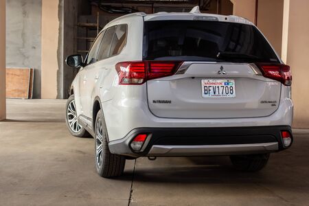 KRIVOY ROG, UKRAINE - DECEMBER 08, 2019: Photo of black Mitsubishi Outlander in covered parking.のeditorial素材