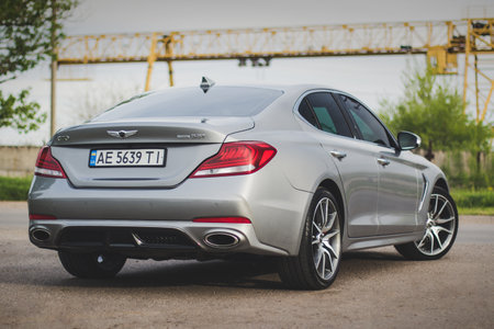 Krivoy Rog, Ukraine - May 4, 2023: Photo of gray car Genesis G70 on the street.のeditorial素材