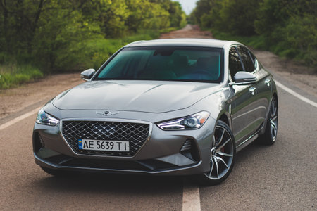 Krivoy Rog, Ukraine - May 4, 2023: Photo of gray car Genesis G70 on the street.のeditorial素材