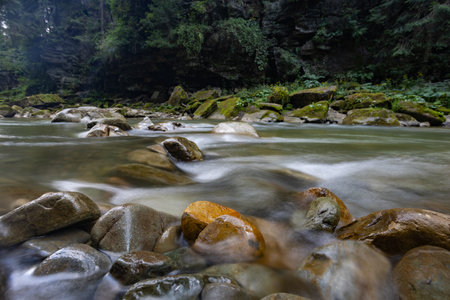Photo of a mountain river with stones.の写真素材