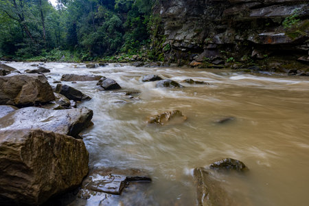 Photo of a mountain river with stones.の写真素材