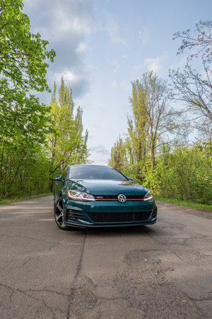 Krivoy Rog, Ukraine - April 14, 2024: Photo of green car Volkswagen Golf GTI on the street.のeditorial素材