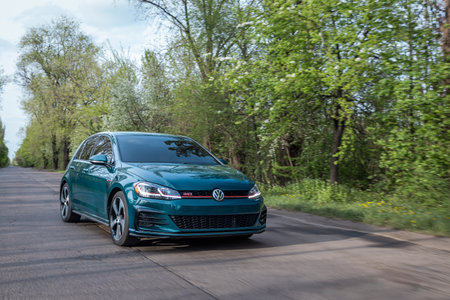 Krivoy Rog, Ukraine - April 14, 2024: Photo of green car Volkswagen Golf GTI on the street.のeditorial素材