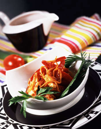 appetizer salad with vegetables on the pattern tablewareの写真素材