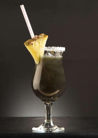 black replenisher alcohol cocktail with pineappleの写真素材