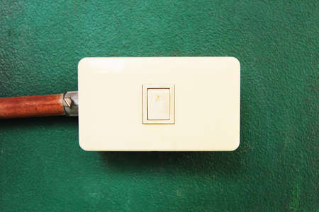 Old Outlet Switch on green Wallの写真素材