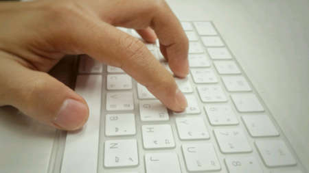 Hand on a keyboard.