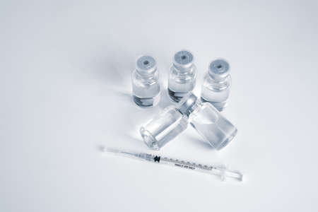 Empty bottle of vaccine with syringe for hygiene injection.の写真素材