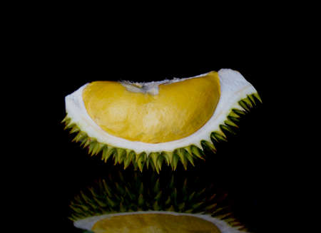 Durian peel closeup dramatic shot on black background.