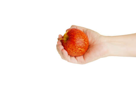 Hand hold red, yellow apple cutout on isolated white background. This juicy healthy fruit is very tasty and has natural vitamin with antioxidant nutrition. Eat as health and diet food.の写真素材