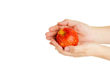 Hand hold red, yellow apple cutout on isolated white background. This juicy healthy fruit is very tasty and has natural vitamin with antioxidant nutrition. Eat as health and diet food.の写真素材