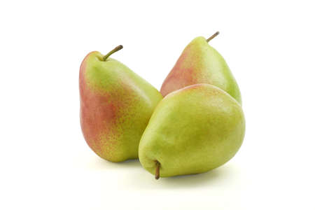 Pear green isolated on white background with cut-off. Fresh raw fruity, juicy, tasty fruit shot in studio. Healthy antioxidant vegetarian food.の写真素材